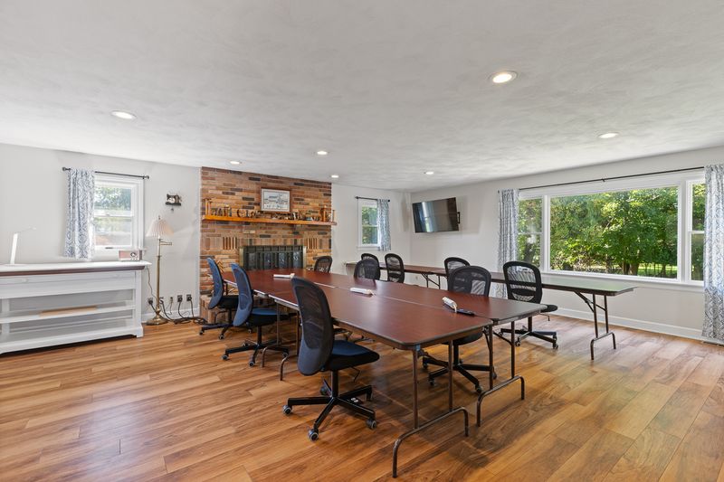 Craft room looking toward the fireplace and the large picture window on the right